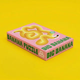 Big Banana Puzzle 500 Teile rosa Schachteln gelber Hintergrund